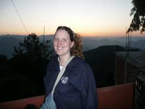 Catherine watching the sun rise over the foothills of the Himalayas